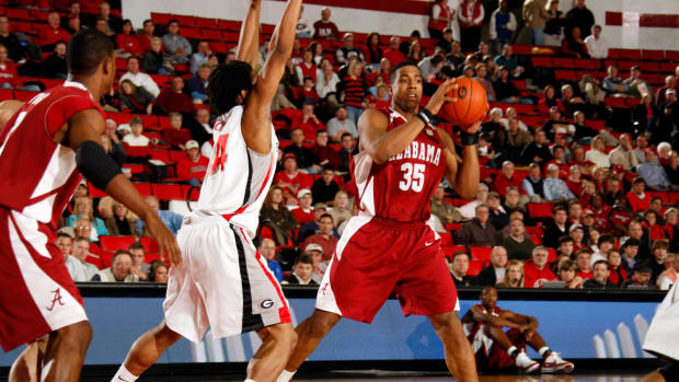January 16, 2008; Athens, GA, USA; Alabama Crimson Tide forward (35) Richard Hendrix handles the ball in the lane against the defense of Georgia Bulldogs forward (34) Albert Jackson in the first half at Stegeman Coliseum. Mandatory Credit: Dale Zanine USA TODAY Sports  