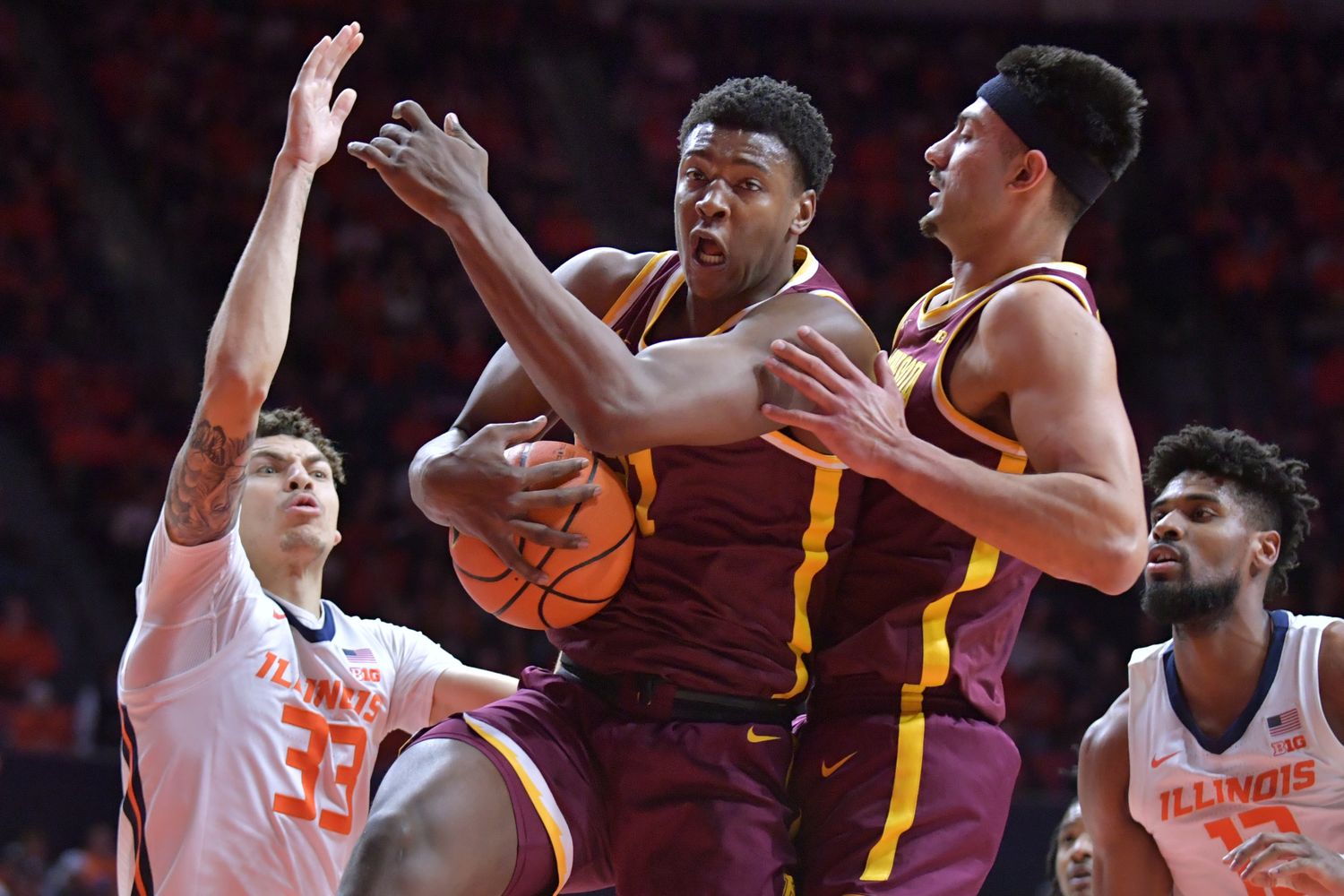 Minnesota forward Pharrel Payne (21) grabs a rebound during the first half against Illinois at State Farm Center in Champaign, Ill., on Feb. 28, 2024.