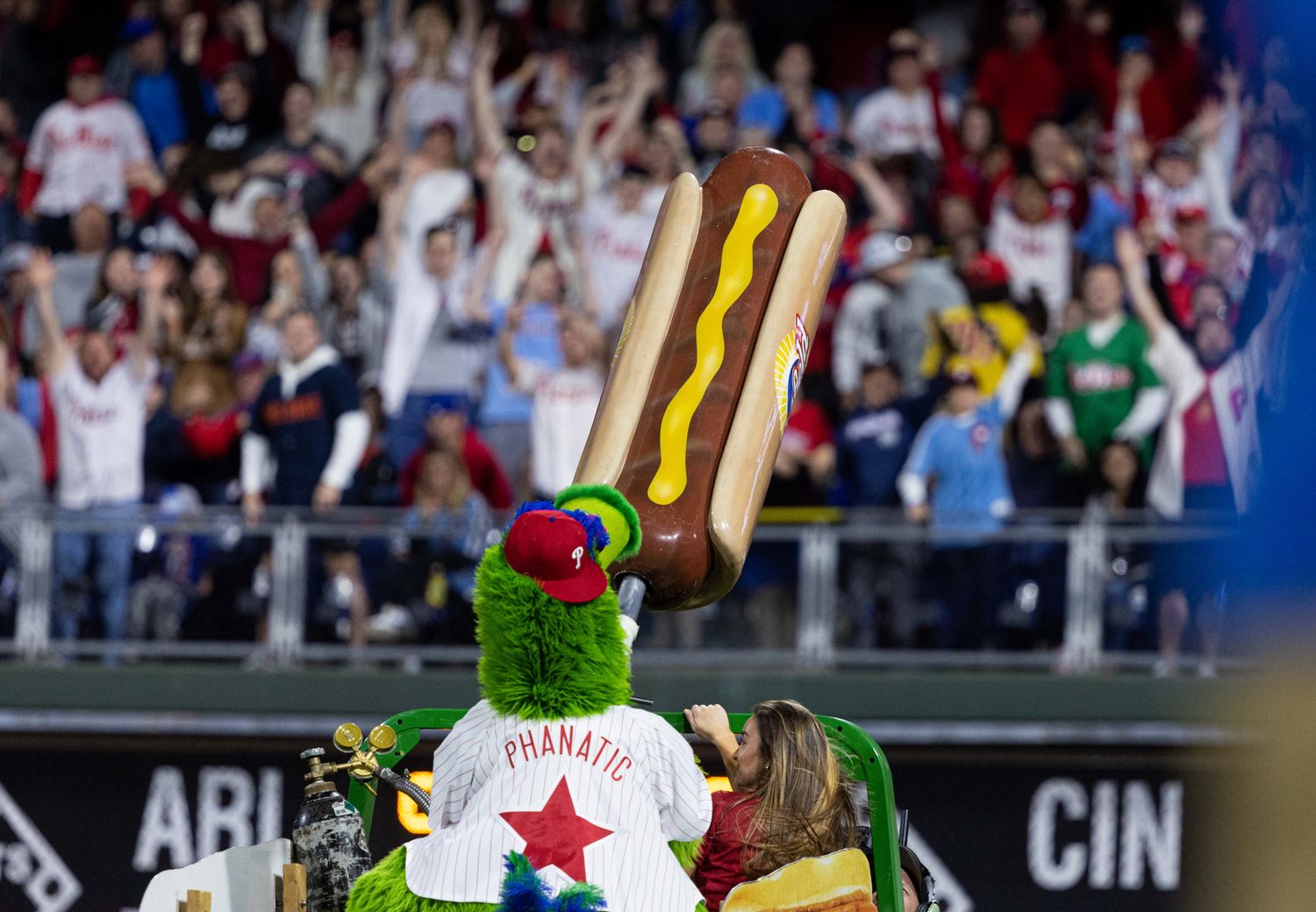 May 3, 2022; Philadelphia, Pennsylvania, USA; The Phillie Phanatic fires hot dogs into the stands between innings of a game between the Philadelphia Phillies and the Texas Rangers at Citizens Bank Park. Mandatory Credit: Bill Streicher-USA TODAY Sports