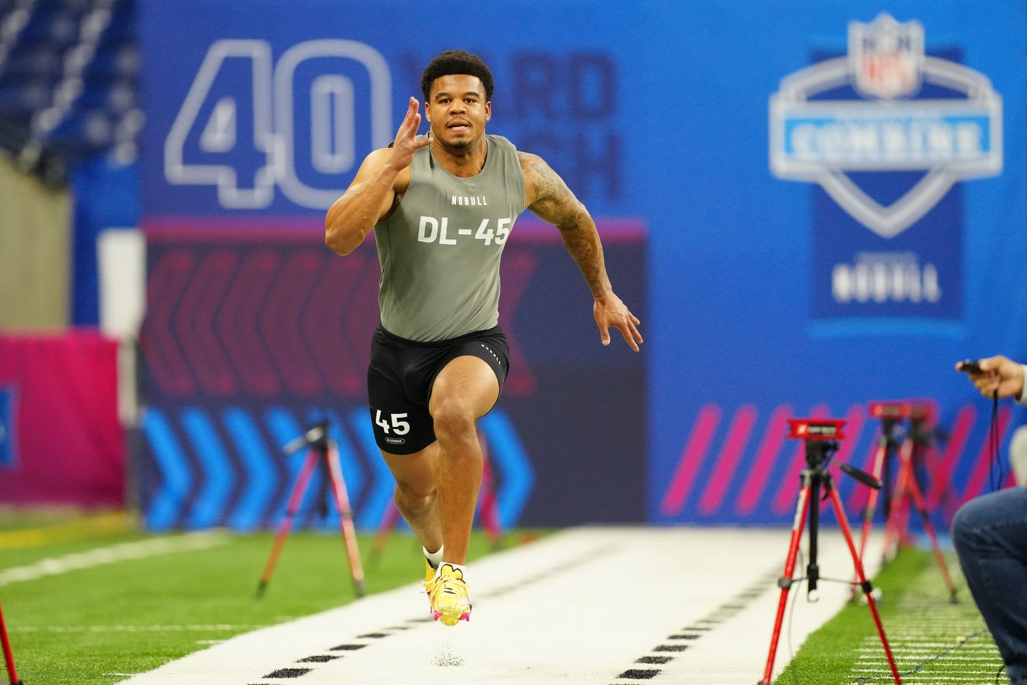 Penn State defensive end Chop Robinson runs the 40-yard dash at the 2024 NFL Scouting Combine.
