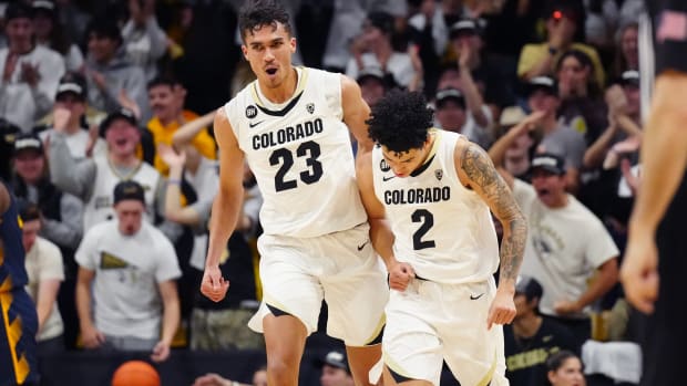 Colorado Buffaloes forward Tristan da Silva (23) celebrates with guard KJ Simpson (2) in the first half against the California Golden Bears at the CU Events Center