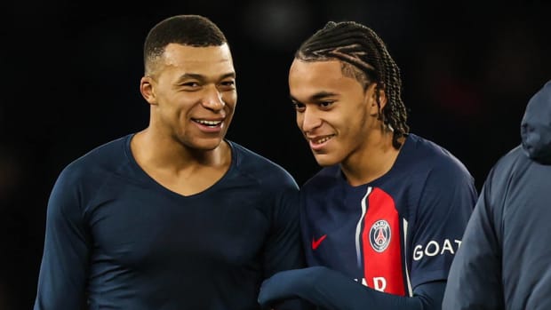 Kylian Mbappe (left) and brother Ethan Mbappe (right) pictured in December 2023 after Paris Saint-Germain's Ligue 1 game against Metz at the Parc des Princes