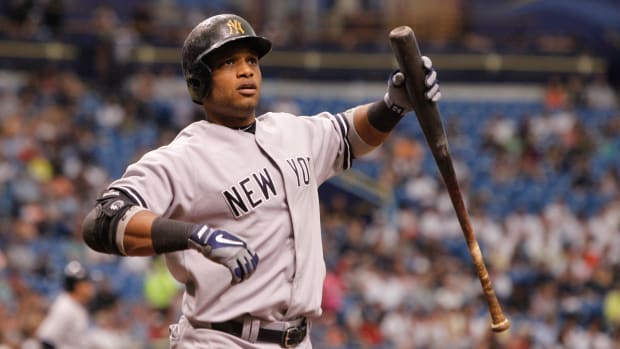 May 26, 2013; St. Petersburg, FL, USA; New York Yankees second baseman Robinson Cano (24) at bat against the Tampa Bay Rays at Tropicana Field. Tampa Bay Rays defeated the New York Yankees 8-3. Mandatory Credit: Kim Klement-USA TODAY Sports