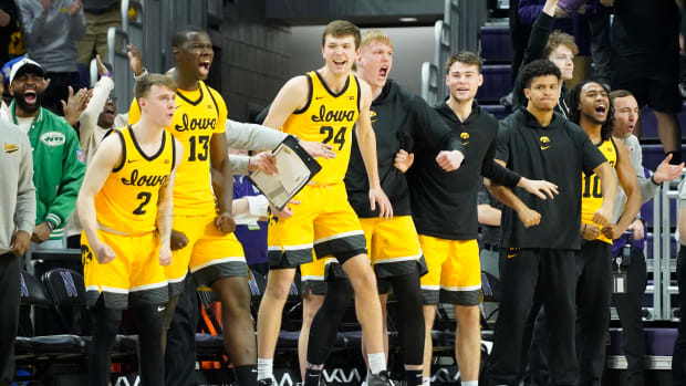 The Iowa Hawkeyes bench celebrates a basket against the Northwestern Wildcats during the second half at Welsh-Ryan Arena on Mar 2, 2024 in Evanston, Ill. (David Banks-USA TODAY Sports)
