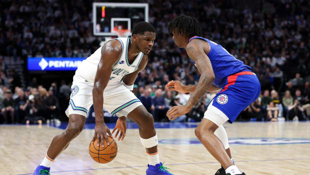 Minnesota Timberwolves guard Anthony Edwards (5) dribbles as LA Clippers guard Bones Hyland (5) defends during the first half at Target Center in Minneapolis on March 3, 2024.