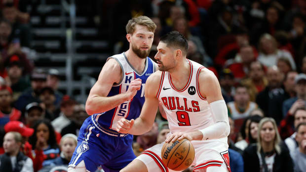 Feb 3, 2024; Chicago, Illinois, USA; Sacramento Kings forward Domantas Sabonis (10) defends against Chicago Bulls center Nikola Vucevic (9) during the second half at United Center. Mandatory Credit: Kamil Krzaczynski-USA TODAY Sports