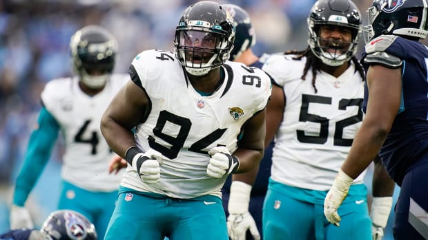 Jacksonvlle Jaguars defensive lineman Foley Fatukasi (94) celebrates after sacking Tennessee Titans quarterback Ryan Tannehill (17) during the third quarter at Nissan Stadium. 