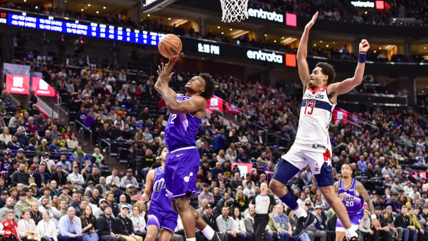Mar 4, 2024; Salt Lake City, Utah, USA; Utah Jazz guard Collin Sexton (2) takes a shot around Washington Wizards guard Jordan Poole (13) during the second half at the Delta Center.