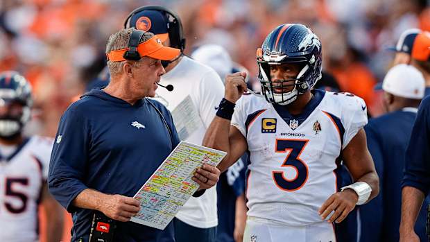 Sep 17, 2023; Denver, Colorado, USA; Denver Broncos head coach Sean Payton talks with quarterback Russell Wilson (3) in the fourth quarter against the Washington Commanders at Empower Field at Mile High. Mandatory Credit: Isaiah J. Downing-USA TODAY Sports