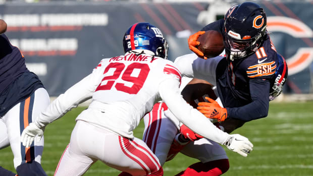 Xavier McKinney moves in for the tackle on Darnell Mooney. The Giants safety is a free agent who went untagged and available to the Bears.