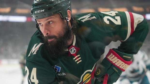 Mar 3, 2024; Saint Paul, Minnesota, USA; Minnesota Wild defenseman Zach Bogosian (24) plays the puck in his defensive zone against the San Jose Sharks in the first period at Xcel Energy Center.
