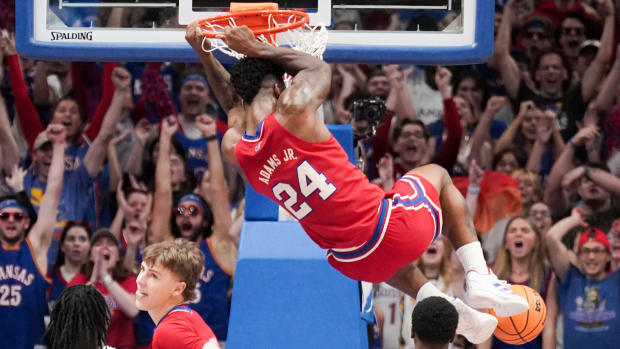 Mar 5, 2024; Lawrence, Kansas, USA; Kansas Jayhawks forward K.J. Adams Jr. (24) dunks the ball against the Kansas State Wildcats during the first half at Allen Fieldhouse. 