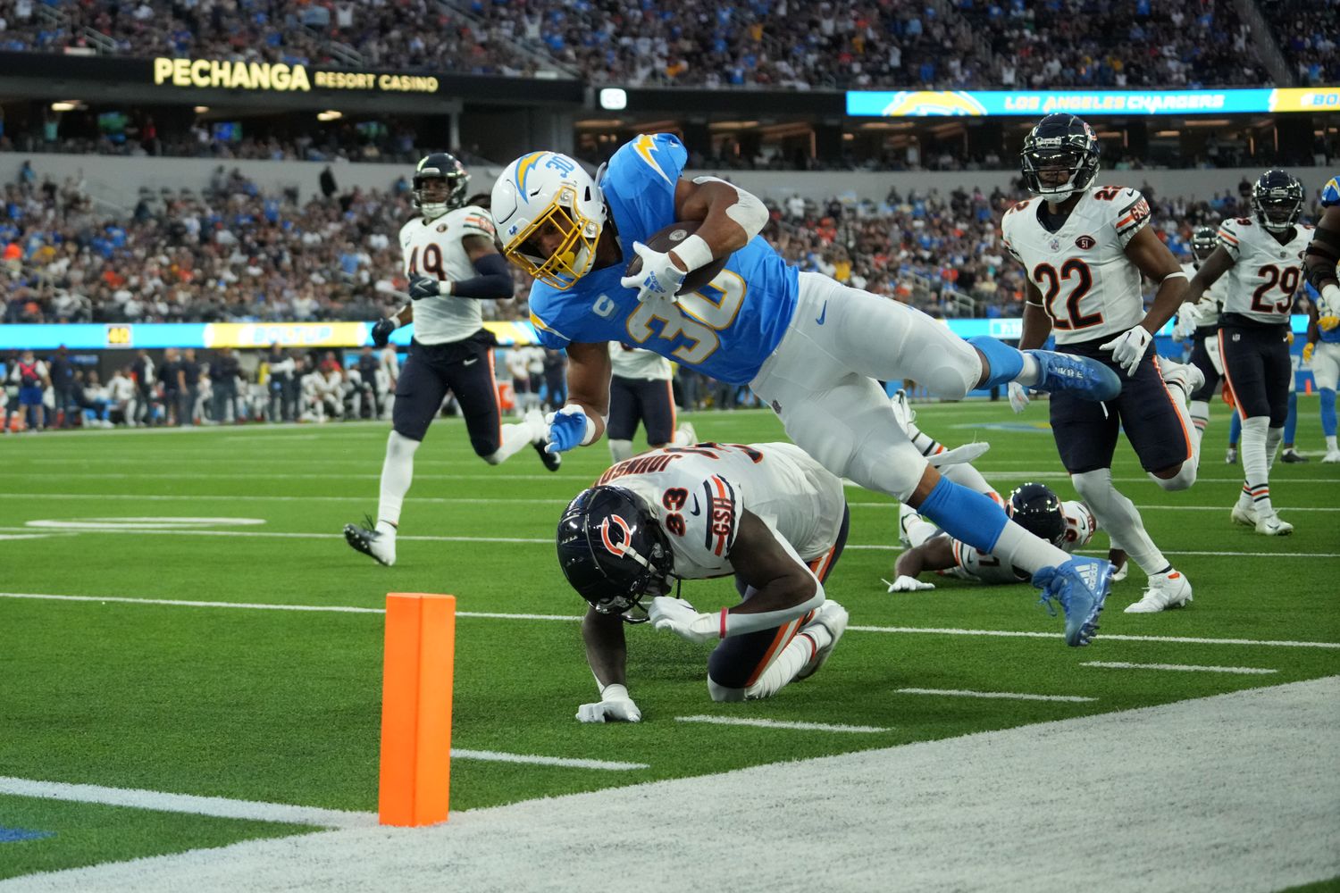 Austin Ekeler dives for a 39-yard TD over the tackle of Jaylon Johnson.