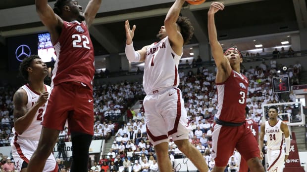 Feb 25, 2023; Tuscaloosa, AL, USA; Arkansas guard Nick Smith Jr. (3) blocks a shot by Alabama guard Mark Sears (1)at Coleman Coliseum. Ncaa Basketball Arkansas Razorbacks At Alabama Crimson Tide  