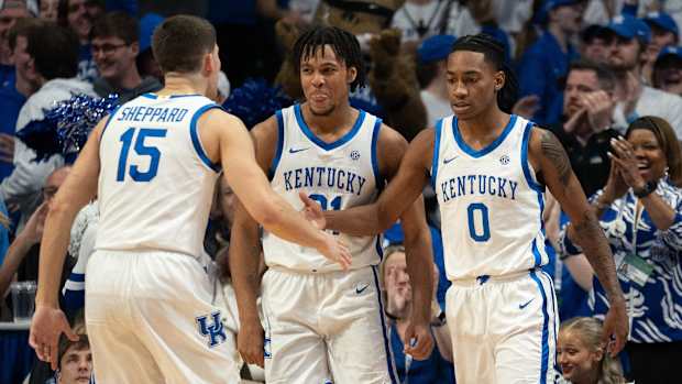 Kentucky Wildcats guard Reed Sheppard (15) celebrates with guard Rob Dillingham (0) after a play during their game against the Arkansas Razorbacks on Saturday, March 2, 2024 at Rupp Arena.