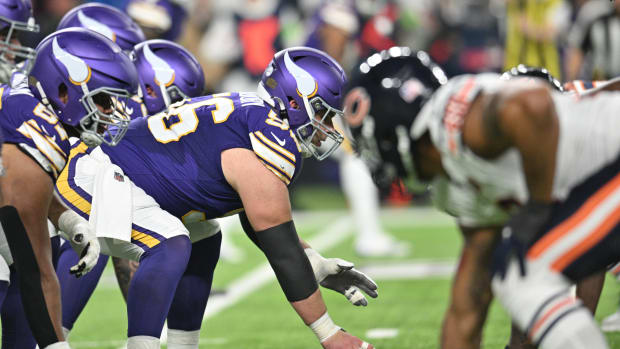 Nov 27, 2023; Minneapolis, Minnesota, USA; Minnesota Vikings center Garrett Bradbury (56) gets ready to snap the ball against the Chicago Bears during the second quarter at U.S. Bank Stadium.
