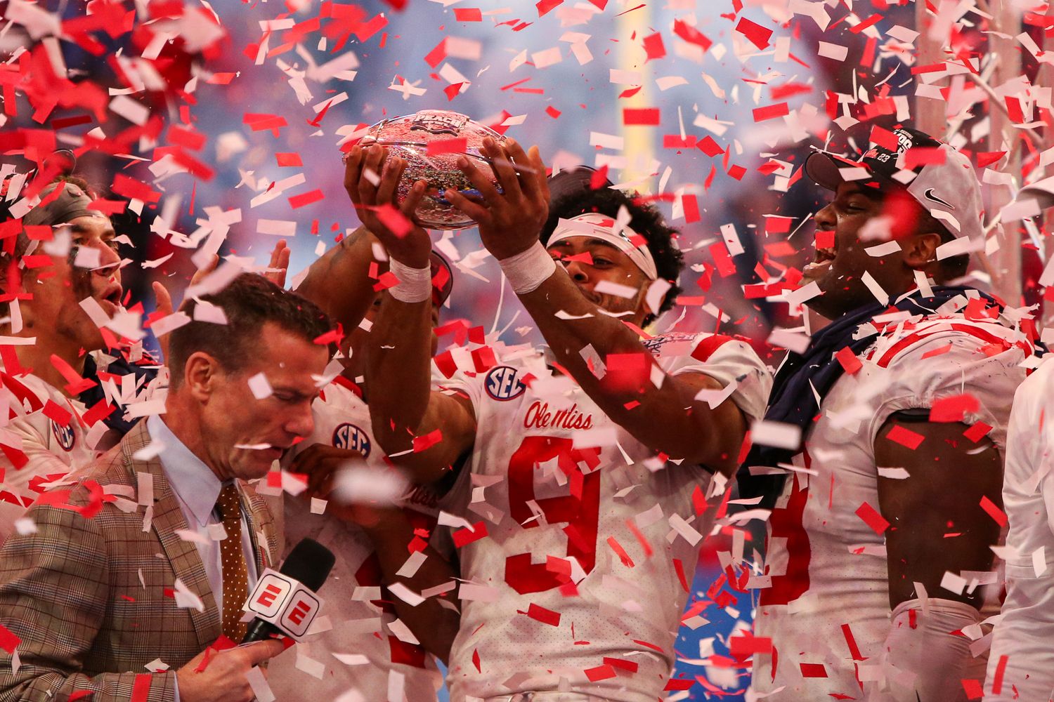 Dec 30, 2023; Atlanta, GA, USA; Mississippi Rebels wide receiver Tre Harris (9) holds up the Peach Bowl trophy after a victory against the Penn State Nittany Lions at Mercedes-Benz Stadium. Mandatory Credit: Brett Davis-USA TODAY Sports