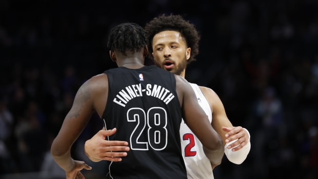  Detroit Pistons guard Cade Cunningham (2) and Brooklyn Nets forward Dorian Finney-Smith (28) hug after the game 