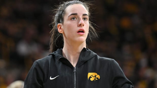 Iowa star Caitlin Clark looks on while warming up before a game.