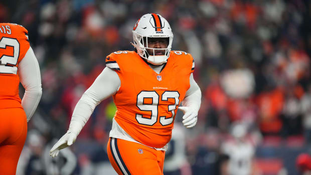 Dec 24, 2023; Denver, Colorado, USA; Denver Broncos defensive tackle D.J. Jones (93) following his sack fumble recovery in the first quarter against the New England Patriots at Empower Field at Mile High. Mandatory Credit: Ron Chenoy-USA TODAY Sports  