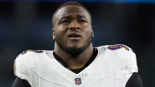Ravens defensive tackle Justin Madubuike warms up before a game.