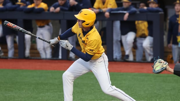 West Virginia freshman Michael Perazza singles in the third inning.