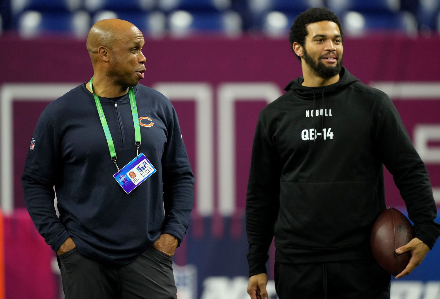 Caleb Williams talks with Bears QB coach Kerry Joseph on the sidelines at the combine.