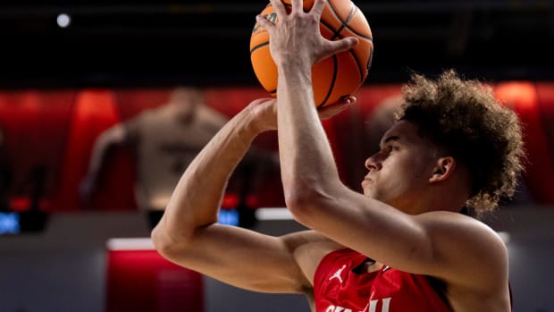 Cincinnati Bearcats guard Dan Skillings Jr. (0) hits a 3-point basket in the second half of the NCAA basketball game between Cincinnati Bearcats and West Virginia Mountaineers at Fifth Third Arena in Cincinnati on Saturday, March 9, 2024.