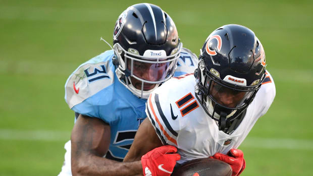 Kevin Byard tries to bring down Darnell Mooney after a catch.