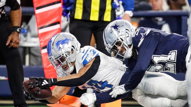 Lions wide receiver Amon-Ra St. Brown scores a touchdown against Cowboys cornerback Stephon Gilmore during the second half of the Lions' 20-19 loss at AT&T Stadium in Arlington, Texas on Saturday, Dec. 30, 2023.
