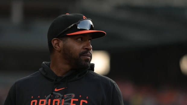 May 12, 2023; Baltimore, Maryland, USA; Baltimore Orioles pitcher Mychal Givens stands in the dugout during the game against the Pittsburgh Pirates at Oriole Park at Camden Yards.