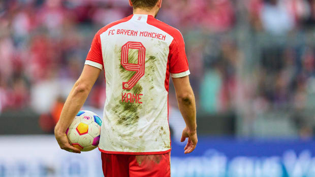 Harry Kane pictured holding the match ball after scoring a hat-trick for Bayern Munich in an 8-1 win over Mainz in the Bundesliga in March 2024