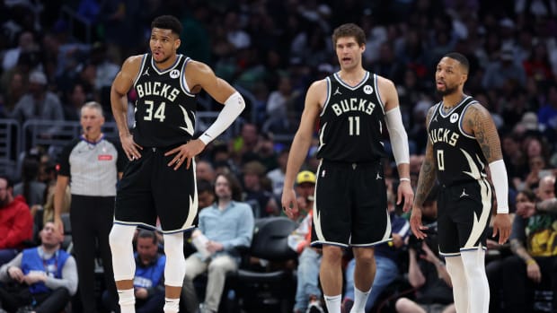 Milwaukee Bucks forward Giannis Antetokounmpo (34) center Brook Lopez (11), and guard Damian Lillard (0)