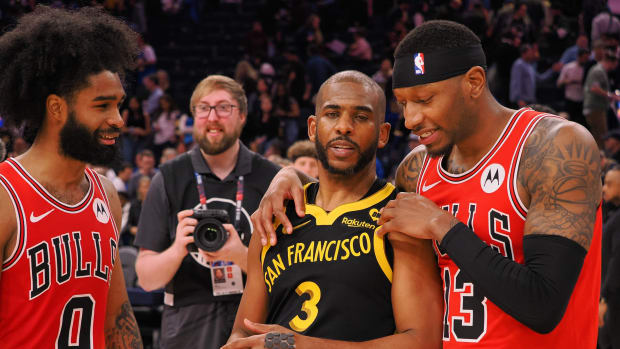  Golden State Warriors guard Chris Paul (3) with Chicago Bulls guard Coby White (0) and forward Torrey Craig (13) after the game at Chase Center.
