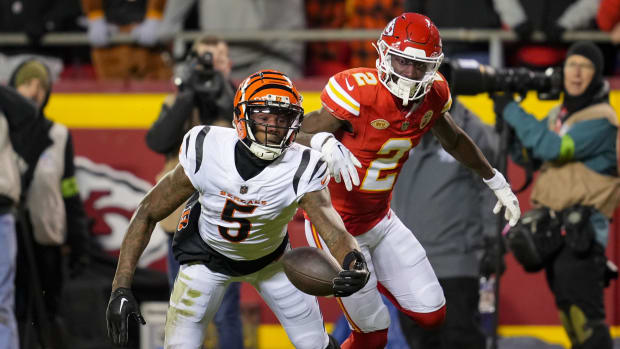 Dec 31, 2023; Kansas City, Missouri, USA; Cincinnati Bengals wide receiver Tee Higgins (5) is unable to make the catch as Kansas City Chiefs cornerback Joshua Williams (2) defends during the second half at GEHA Field at Arrowhead Stadium.