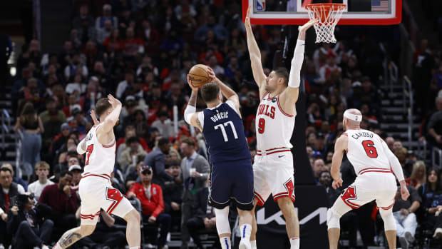 Dallas Mavericks guard Luka Doncic (77) shoots against the Chicago Bulls during the first half at United Center. 