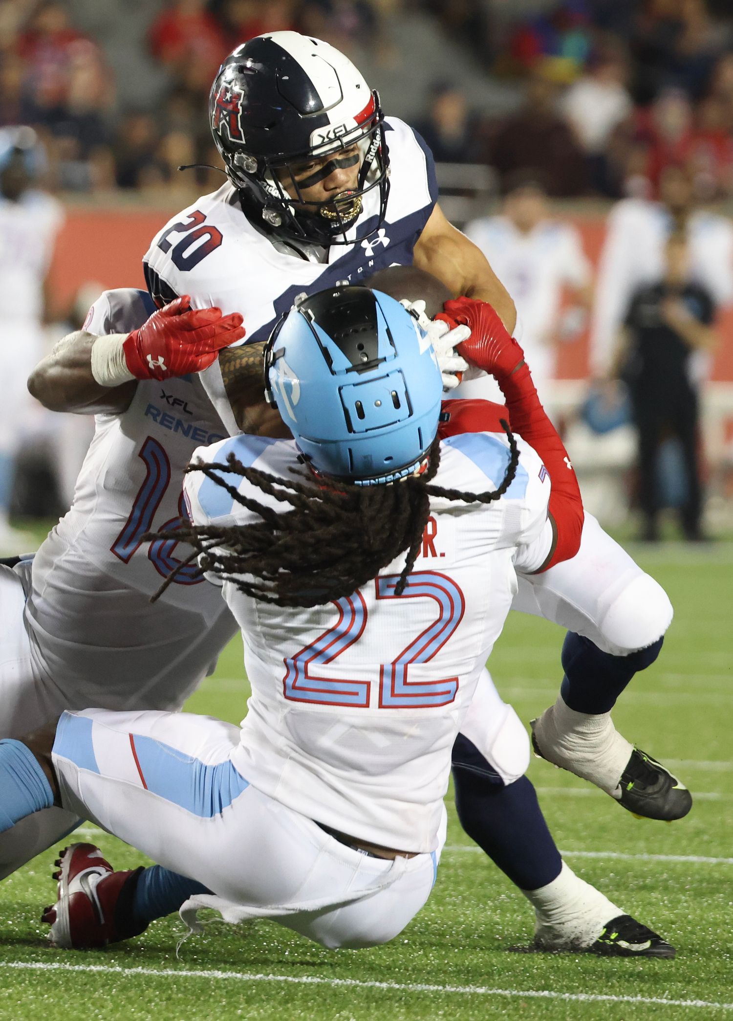 Feb 26, 2023; Houston, TX, USA; Houston Roughnecks running back Dejourn Lee (20 ) rushes against Arlington Renegades defensive back Jamal Carter (22) in the fourth quarter at TDECU Stadium. Mandatory Credit: Thomas Shea-USA TODAY Sports  