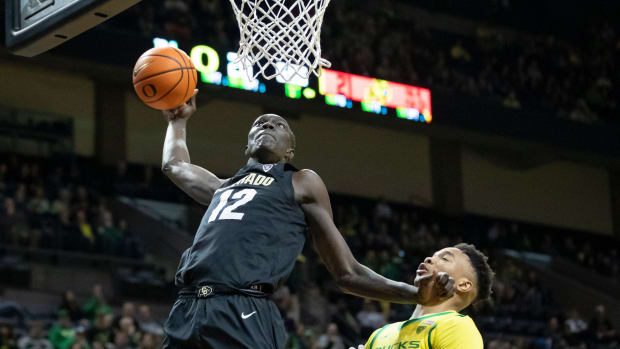 Colorado forward Bangot Dak dunks the ball as the Oregon Ducks host the Colorado Buffaloes Thursday, March 7, 2024 at Matthew Knight Arena in Eugene, Ore