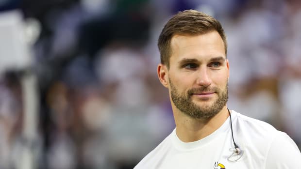 Dec 24, 2023; Minneapolis, Minnesota, USA; Minnesota Vikings quarterback Kirk Cousins (8) looks on from the bench during the second quarter against the Detroit Lions at U.S. Bank Stadium