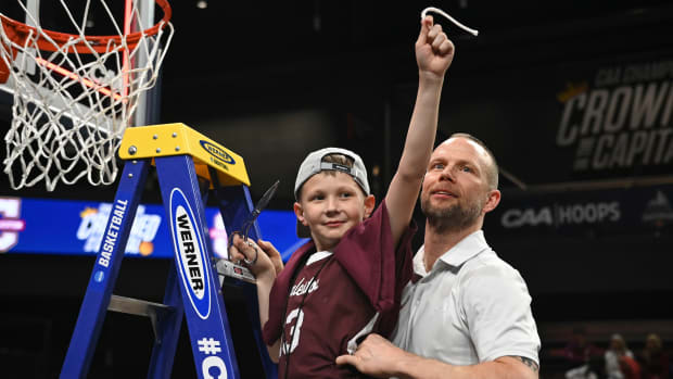 Johnny and Pat Kelsey after Charleston’s 63-58 win over UNC Wilmington in the CAA tournament championship on March 7, 2023.