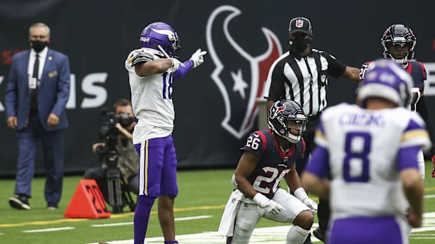 Oct 4, 2020; Houston, Texas, USA; Minnesota Vikings wide receiver Justin Jefferson (18) signals after making a reception against the Houston Texans for a first down during the second quarter at NRG Stadium.