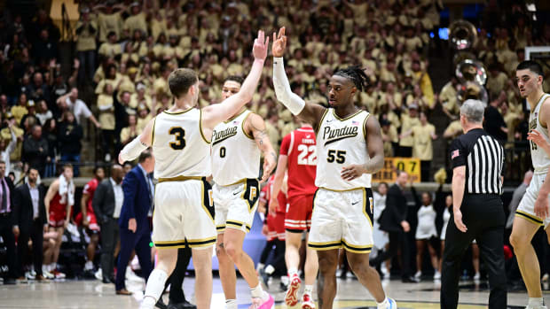 Purdue Boilermakers guard Lance Jones (55) and guard Braden Smith (3) celebrate during a timeout during the second half against the Wisconsin Badgers at Mackey Arena.