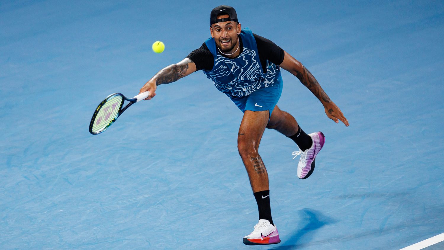 Nick Kyrgios of Australia hits a shot during an exhibition practice match against Novak Djokovic.