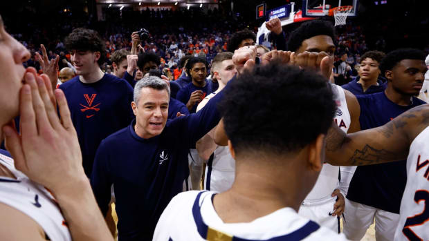 Tony Bennett addresses his team before the Virginia men's basketball game against Georgia Tech at John Paul Jones Arena.