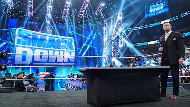 WWE SmackDown General Manager Nick Aldis in the ring for a contract signing.