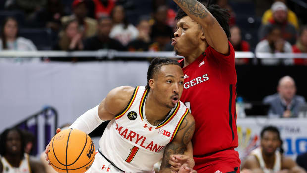 Maryland Terrapins guard Jahmir Young (1) works around Rutgers Scarlet Knights guard Jamichael Davis (1) during the second half at Target Center.