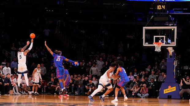 Villanova Wildcats guard Justin Moore (5) hits a three-point shot against DePaul during the second half at Madison Square Garden in New York City on March 13, 2024.