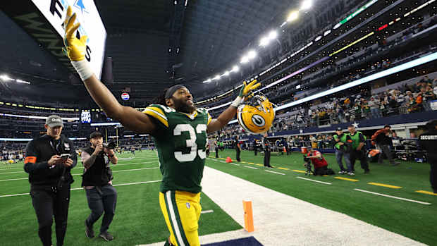 Jan 14, 2024; Arlington, Texas, USA; Green Bay Packers running back Aaron Jones (33) reacts after defeating the Dallas Cowboys in the 2024 NFC wild card game at AT&T Stadium.