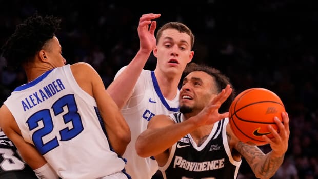 Mar 14, 2024; New York City, NY, USA; Providence Friars guard Devin Carter (22) drives on Creighton Bluejays guard Trey Alexander (23) and center Ryan Kalkbrenner (11) during the second half at Madison Square Garden.