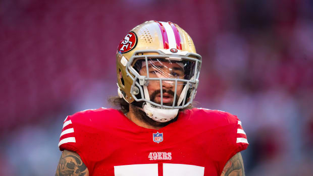 Dec 17, 2023; Glendale, Arizona, USA; San Francisco 49ers guard Jon Feliciano (55) against the Arizona Cardinals at State Farm Stadium. Mandatory Credit: Mark J. Rebilas-USA TODAY Sports  